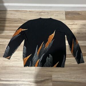 Black Sweater with Orange and Gray Abstract Flame Design